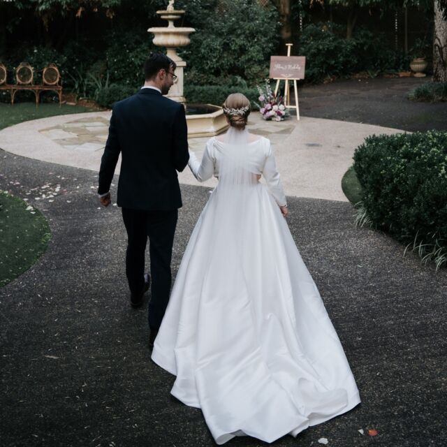 Beautiful shot of Felicia & Nicholas!  Stunning gown and hairstyle.

Photography by #artofgrace 

#justmarried #melbourneweddings #weddinginspiration #weddingvenues #weddings #brideandgroom #winterweddings #weddingreceptions #weddinginspo #outdoordecor #easternsuburbs #weddingdress #elizabethanlodge #gardens #mrandmrs #receptions #weddingphotography #weddingday #weddingdecor #northblackburn